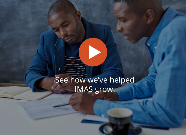 Two Employees of IMAS in a Meeting